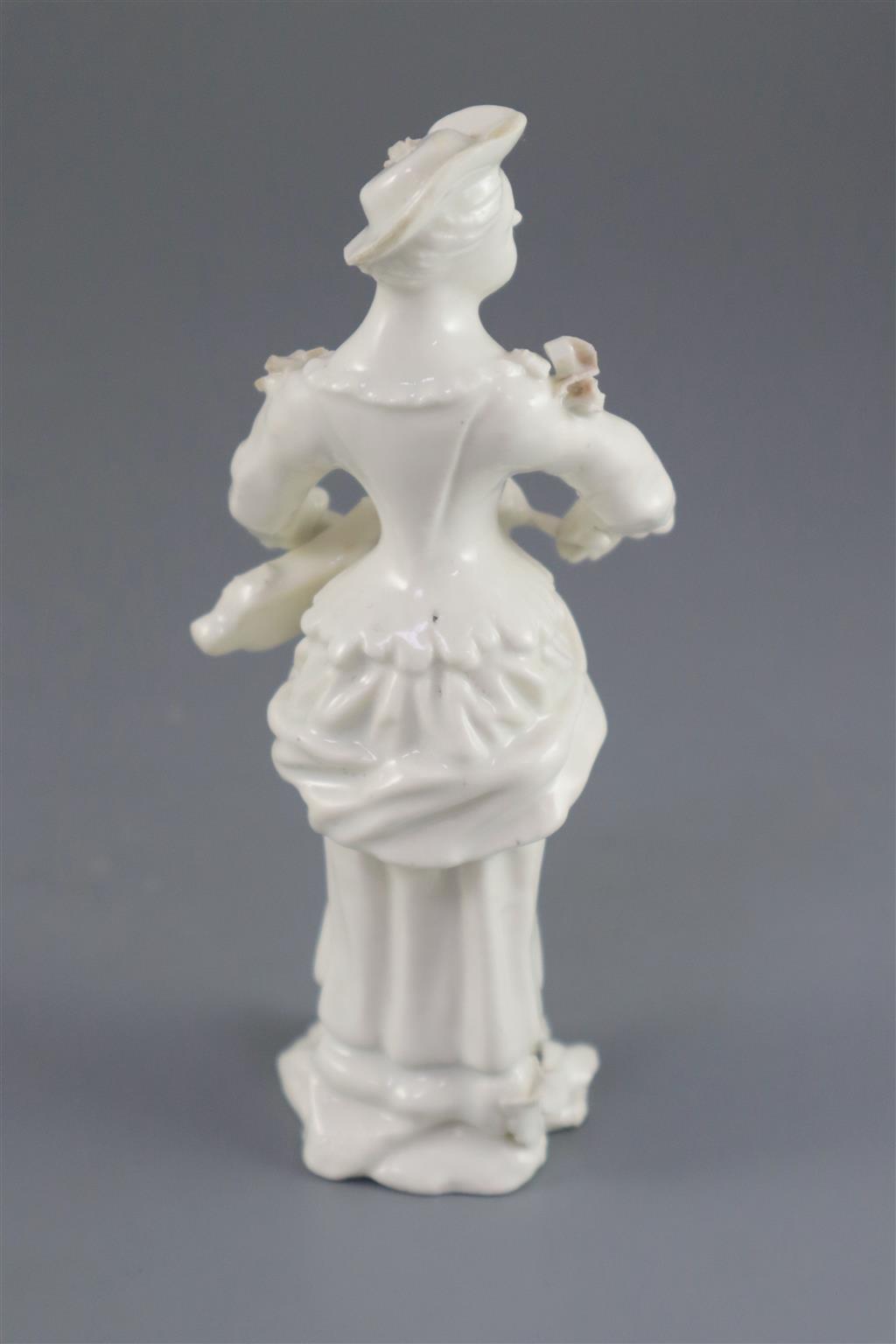 A rare French porcelain figure of a lady playing the Hurdy Gurdy, probably Orleans, c.1756-58, 13cm high